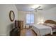 Spare bedroom with wood-look flooring, ceiling fan, and bright natural light at 27158 W Potter Dr, Buckeye, AZ 85396