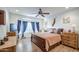 This bedroom features a ceiling fan and an en-suite bathroom at 27158 W Potter Dr, Buckeye, AZ 85396