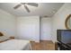 Secondary bedroom with sliding door closet and ceiling fan at 27158 W Potter Dr, Buckeye, AZ 85396