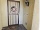 Welcoming entryway with a charming decorative door and a classic wall light at 27158 W Potter Dr, Buckeye, AZ 85396