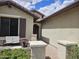 Charming entryway with a cozy patio and well-maintained landscaping, creating a welcoming first impression at 27158 W Potter Dr, Buckeye, AZ 85396