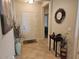 Warm foyer with decorative accents, tile flooring, and a glimpse into the inviting living spaces at 27158 W Potter Dr, Buckeye, AZ 85396