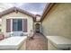 Cozy front porch with seating, decorative accents, and a welcoming entryway at 27158 W Potter Dr, Buckeye, AZ 85396