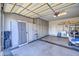 Well-organized garage with ample storage, work area, and epoxy flooring for easy maintenance at 27158 W Potter Dr, Buckeye, AZ 85396