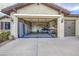 Spacious garage with high ceilings, storage cabinets, and plenty of room for vehicles and hobbies at 27158 W Potter Dr, Buckeye, AZ 85396