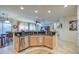 Bright kitchen with stainless steel appliances, granite countertops, and a view into the living space at 27158 W Potter Dr, Buckeye, AZ 85396