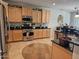 Well-equipped kitchen featuring wooden cabinets, stainless steel appliances, and granite countertops at 27158 W Potter Dr, Buckeye, AZ 85396