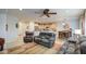 Inviting living room with tile flooring and an open floor plan to the kitchen at 27158 W Potter Dr, Buckeye, AZ 85396