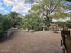 Landscaped backyard patio area with brick pavers and multiple seating areas at 27158 W Potter Dr, Buckeye, AZ 85396