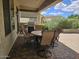 Outdoor patio features brick pavers, built-in grill, and dining table perfect for entertaining in style at 27158 W Potter Dr, Buckeye, AZ 85396