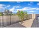 Paver patio with metal fencing and partial privacy offered by foliage; perfect for outdoor living at 3076 E Dunbar Dr, Phoenix, AZ 85042