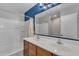 This bathroom features double sinks, shower and tub, and a large mirror at 3076 E Dunbar Dr, Phoenix, AZ 85042