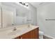 This bathroom offers double sinks, a large mirror and a shower/tub combo at 3076 E Dunbar Dr, Phoenix, AZ 85042