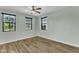 Bright bedroom with laminate floors, three windows with blinds allowing plenty of natural light at 3076 E Dunbar Dr, Phoenix, AZ 85042