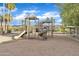 Well-equipped playground with slides and climbing structures set in a sandy area for play at 3076 E Dunbar Dr, Phoenix, AZ 85042