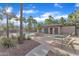 Community pool area with lounge chairs, palm trees, and a spa for relaxation and recreation at 3076 E Dunbar Dr, Phoenix, AZ 85042