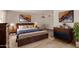 Stylized bedroom with a wood-look floor, modern furniture, and comfortable lighting at 3248 E Windrose Dr, Phoenix, AZ 85032
