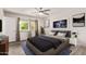 Comfortable bedroom featuring a ceiling fan, natural light, and modern decor at 3248 E Windrose Dr, Phoenix, AZ 85032