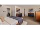 Well-lit bedroom with modern decor, plush bedding, and coordinating furniture at 3248 E Windrose Dr, Phoenix, AZ 85032