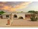 Charming single-story home featuring unique architectural details and desert landscaping with a decorative brick pillar mailbox at 3248 E Windrose Dr, Phoenix, AZ 85032