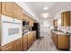 Bright kitchen with wooden cabinets, granite countertops, and modern appliances at 3248 E Windrose Dr, Phoenix, AZ 85032