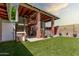 Outdoor patio includes storage, workspace, and access to backyard at 3248 E Windrose Dr, Phoenix, AZ 85032