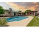 Sparkling pool in a private backyard oasis with lush landscaping at 3248 E Windrose Dr, Phoenix, AZ 85032