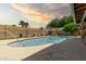 Backyard pool with desert landscaping, block wall, and covered patio at 3248 E Windrose Dr, Phoenix, AZ 85032