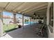 Outdoor covered patio overlooking sparkling pool and putting green; perfect for relaxing and entertaining at 3300 N Coronado St, Chandler, AZ 85224