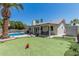 An expansive backyard includes a putting green and a pristine pool area, creating an ideal outdoor retreat at 3300 N Coronado St, Chandler, AZ 85224