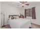 Comfortable bedroom featuring soft neutral tones, a cozy bed, and a ceiling fan at 3300 N Coronado St, Chandler, AZ 85224