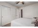 Bedroom featuring a ceiling fan, closet, and white walls at 3300 N Coronado St, Chandler, AZ 85224