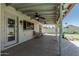 Spacious covered patio with outdoor seating and a view of the beautifully landscaped backyard at 3300 N Coronado St, Chandler, AZ 85224