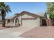 Single-story house featuring a two-car garage with a desert-landscaped front yard at 3300 N Coronado St, Chandler, AZ 85224