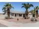 Charming home with a front yard boasting mature palm trees and desert landscaping at 3300 N Coronado St, Chandler, AZ 85224