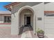 Welcoming front entrance with an arched doorway and a well-maintained stone walkway at 3300 N Coronado St, Chandler, AZ 85224