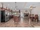Modern kitchen with stainless steel appliances, rich wood cabinets, and a center island with seating at 3300 N Coronado St, Chandler, AZ 85224