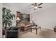 Spacious living room with ceiling fan, cozy seating, and large windows at 3300 N Coronado St, Chandler, AZ 85224