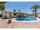 Backyard featuring a sparkling blue swimming pool and covered patio, perfect for outdoor relaxation at 3300 N Coronado St, Chandler, AZ 85224