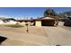 Charming one-story home featuring a covered parking area, low maintenance yard, and neutral color palette at 3434 W Augusta Ave, Phoenix, AZ 85051