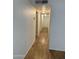 Hallway with neutral paint and wood-style floors at 3434 W Augusta Ave, Phoenix, AZ 85051
