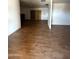Spacious living room with hardwood flooring and bright natural light at 3434 W Augusta Ave, Phoenix, AZ 85051