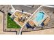 Birds eye view of the community playground, pool, lounge seating, and parking area at 4050 E Brittlebush Ln, San Tan Valley, AZ 85140