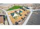 Aerial view showcasing a community playground, picnic area, seating, and parking at 4050 E Brittlebush Ln, San Tan Valley, AZ 85140