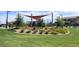 Community playground offering a recreational area with lush greenery, trees, flowers, and a shaded playground at 4050 E Brittlebush Ln, San Tan Valley, AZ 85140