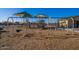 Community playground with swings, slides, playground equipment, and protective ground cover for safety and enjoyment at 4050 E Brittlebush Ln, San Tan Valley, AZ 85140
