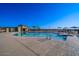 Community pool with seating, umbrellas and changing cabana offers residents a relaxing outdoor space at 4050 E Brittlebush Ln, San Tan Valley, AZ 85140