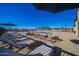 Resort-style community pool featuring ample lounge chairs and shade umbrellas for relaxation at 4050 E Brittlebush Ln, San Tan Valley, AZ 85140