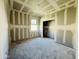 Bedroom under construction with a window providing natural light and a closet ready to be finished at 46904 W Coe St, Maricopa, AZ 85139