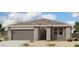Charming single-story home featuring a two-car garage, neutral paint, and desert landscaping at 46904 W Coe St, Maricopa, AZ 85139